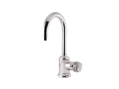 Single lever basin mixer with decorated brass ring
